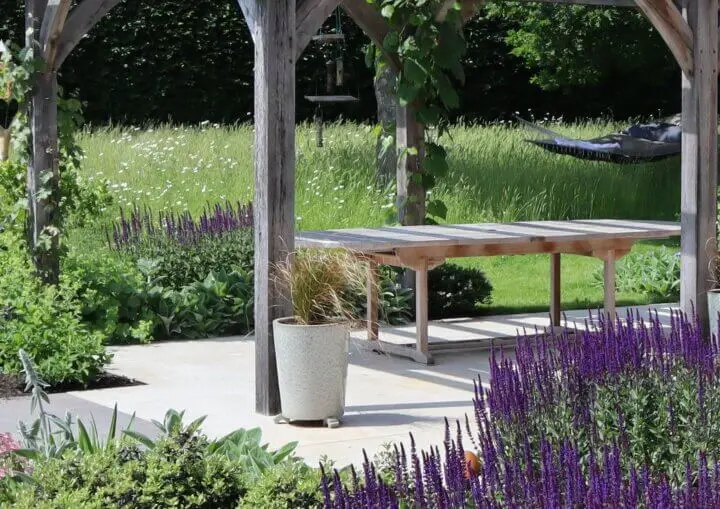 Main title photo of New Forest country garden with a pergola and hammock