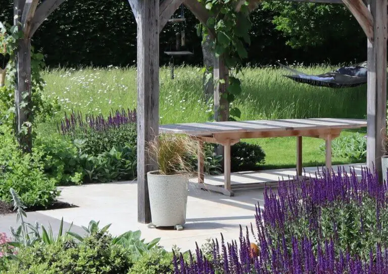 Main title photo of New Forest country garden with a pergola and hammock