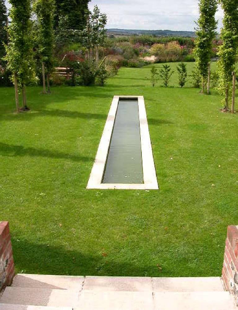 Contemporary Country Garden - view of the water feature from house